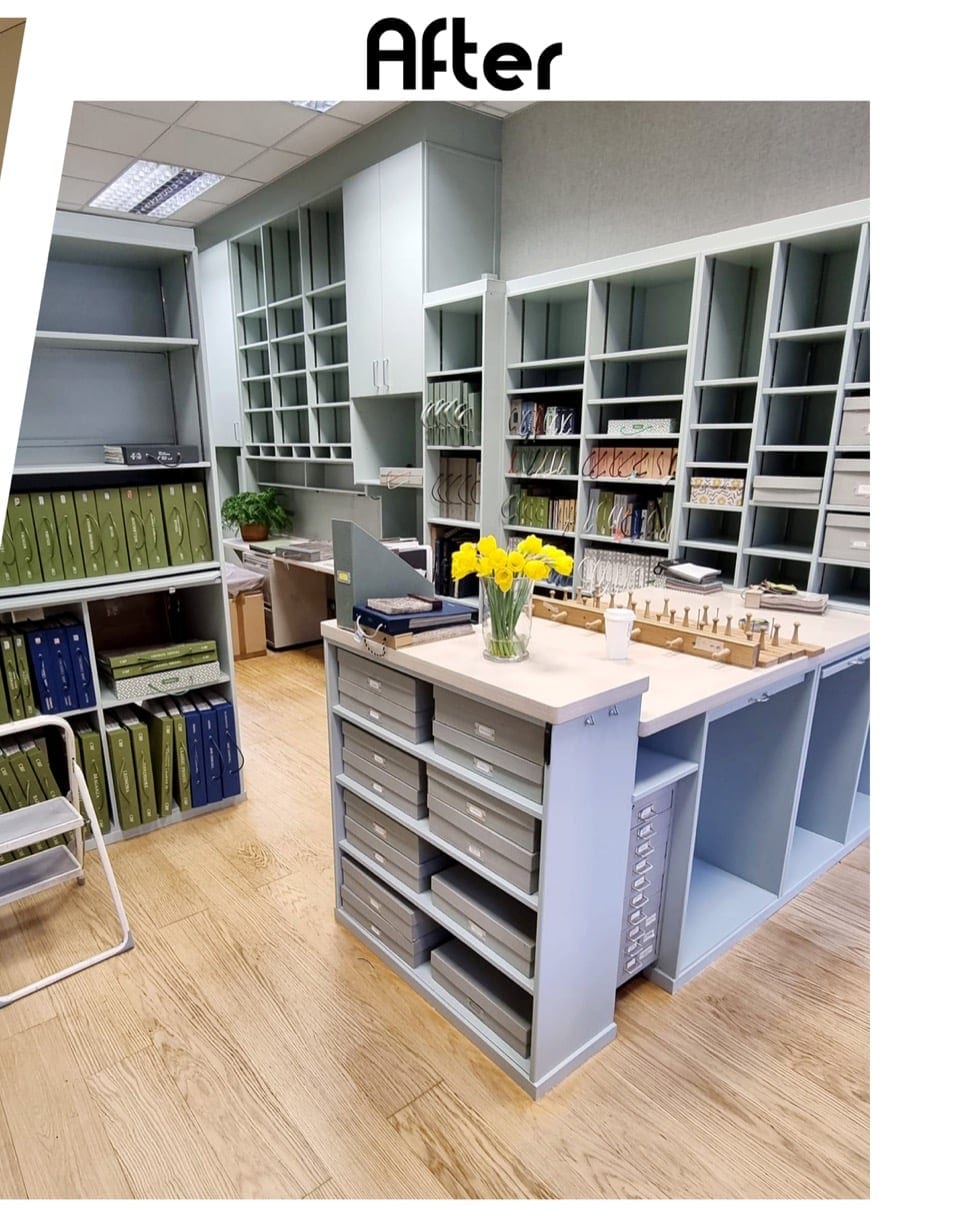 Built-in storage and shelving repainted in a muted blue-grey cabinetry finish.